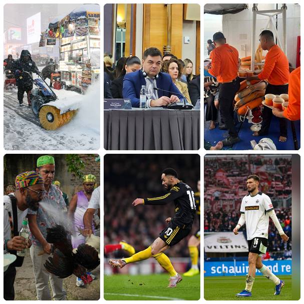 Работници чистят натрупания сняг по Таймс Скуеър в Ню Йорк